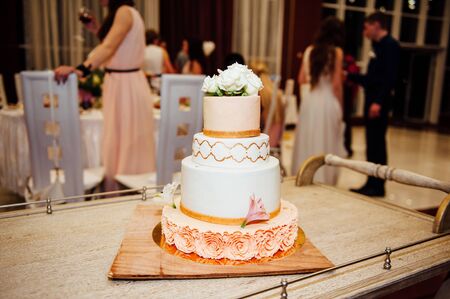 Expensive, elegant vintage wedding cake with flowers and ornaments close-upの写真素材