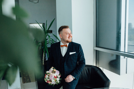 A handsome man is waiting for his belovedの写真素材