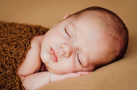 beautiful newborn sleeping baby boyの写真素材