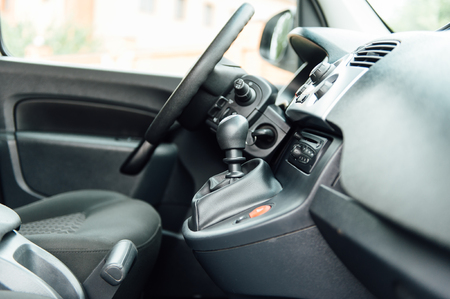 interior of a modern car with six gear lever and steering wheel. prestigious salon of the minivanの写真素材