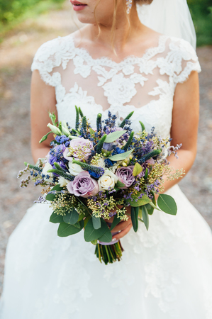 beautiful bouquet in hands of the brideの写真素材