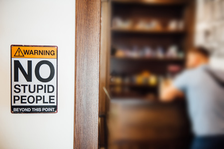 No stupid people inscription at the entrance to the barber shopの写真素材