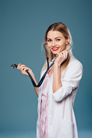 smiling girl doctor looking at the cameraの写真素材