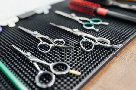 Mens hairdressing desktop with tools for shavingの写真素材