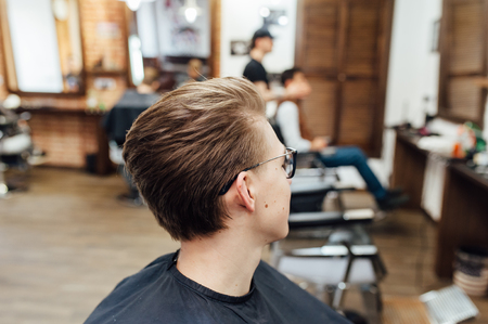 male model shows a haircut in a barber shopの写真素材