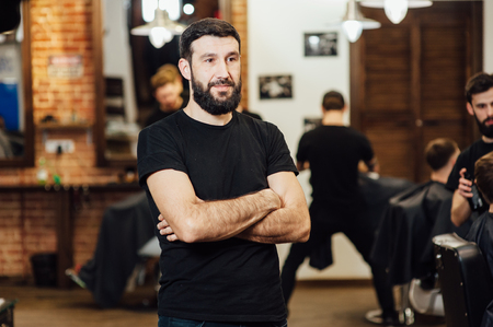 Professional hairstylist in barbershop interiorの写真素材