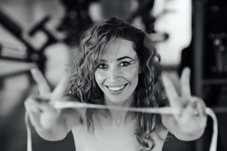 Woman with red hair shows her weight loss.の写真素材