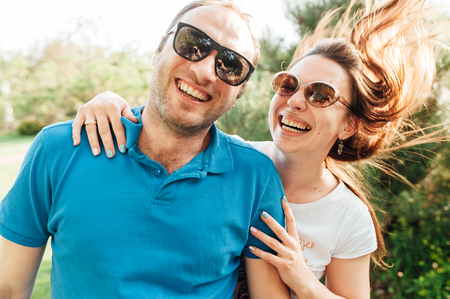 Close up funny beauty portrait of happy hipster coupleの写真素材