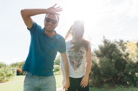 Close up funny beauty portrait of happy hipster coupleの写真素材