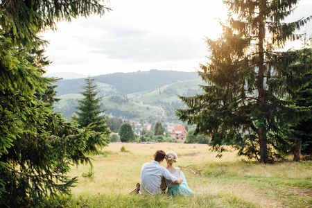 Couple in love walking in the mountains, having funの写真素材