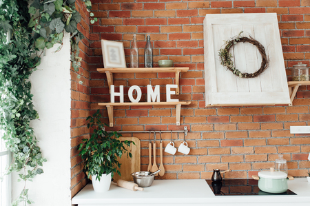 Kitchen Interior with Island, Sink, Cabinets, and Hardwood Floorsの写真素材