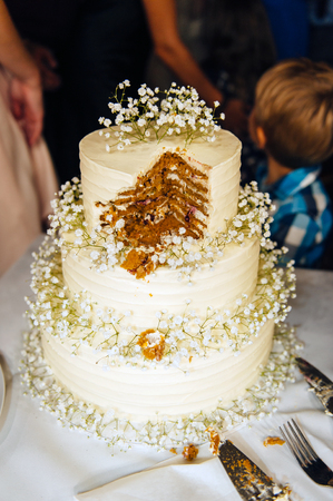 wedding cake three floors outside in the eveningの写真素材