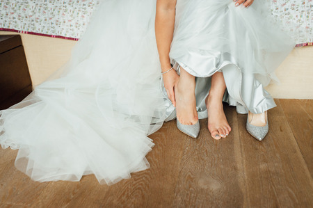 beautiful and athletic legs of the bride in wedding shoes.の写真素材