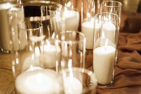 Luxury, fashion wedding decoration wedding, wedding table, restaurant. Candles in glasses. Wedding ceremony in the winter.の写真素材