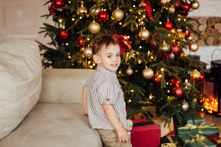 beautiful baby boy playing with toys and smilingの写真素材
