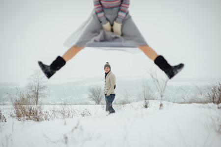 Happy Young Couple in Winter Park having fun.Family Outdoors. loveの写真素材