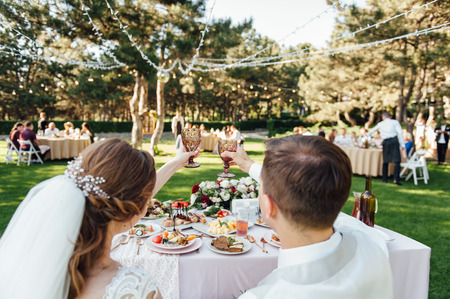 . Bride and groom toasting champagne glasses. Close up.の写真素材