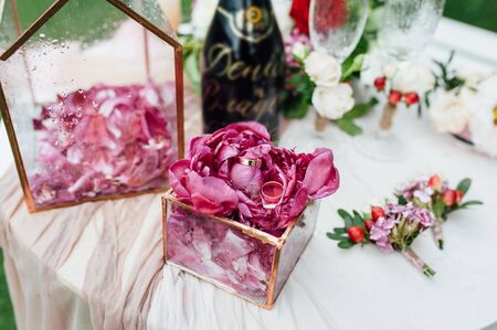 wedding rings in a glass box on the table for ceremonies.