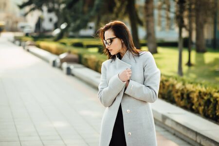 beautiful girl with brunette hair, posing outside, hipster styleの写真素材