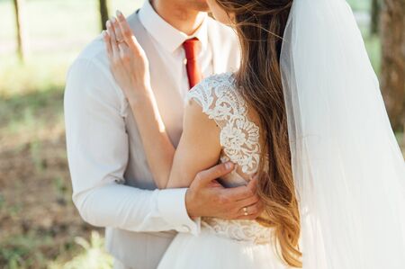 Young wedding couple outdoor. Groom and bride togetherの写真素材