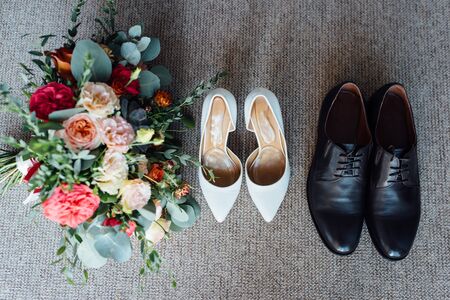 Wedding floristics and details. Wedding invitations on floor.の写真素材