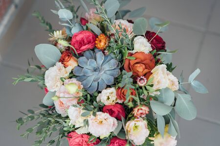 Bridal bouquet. The brides bouquet. Beautiful bouquet of white, blue, pink flowers and greeneryの写真素材