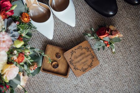 Wedding floristics and details. Wedding invitations on floor.の写真素材