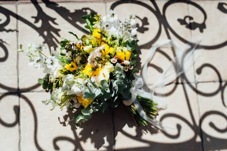 Wedding bouquet from beautiful flowers: pink roses, white and pink ranunculusの写真素材