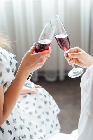 group of people touch champagne glasses and cocktailsの写真素材