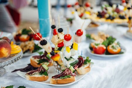 catering services background with snacks on guests table in restaurant at event partyの写真素材