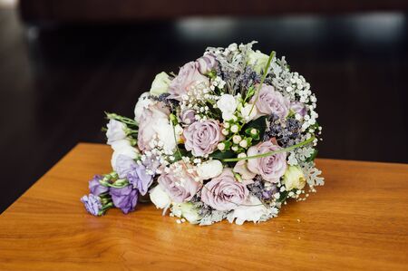 Wedding bouquet from beautiful flowers: pink roses, white and pink ranunculusの写真素材