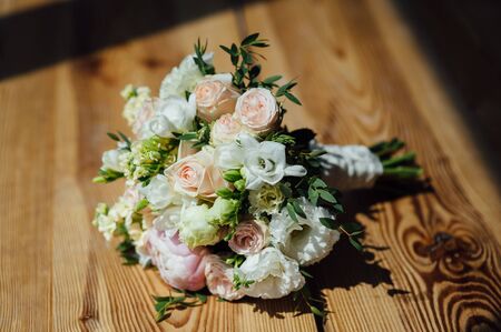 Wedding bouquet from beautiful flowers: pink roses, white and pink ranunculusの写真素材