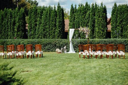 Arch for the wedding ceremony, decorated with cloth and flowersの写真素材