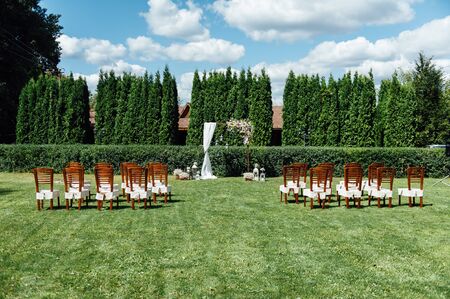 Arch for the wedding ceremony, decorated with cloth and flowersの写真素材