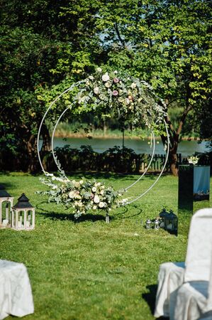Arch for the wedding ceremony, decorated with cloth and flowers.の写真素材
