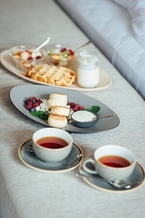 delicious breakfast for two on bed at the luxury hotel.の写真素材