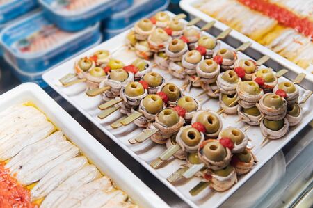 A wide variety of traditional tapas with seafood in Spain at the San Miguel marketの写真素材