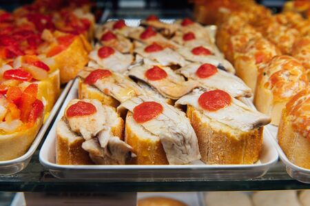 A wide variety of traditional tapas with seafood in Spain at the San Miguel marketの写真素材