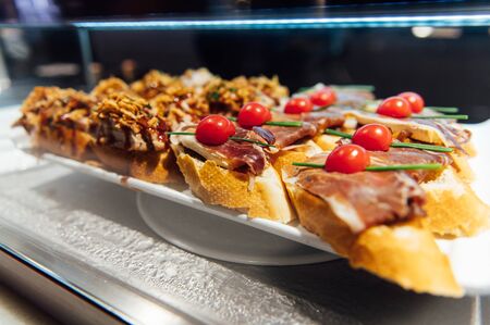 A wide variety of traditional tapas with seafood in Spain at the San Miguel marketの写真素材