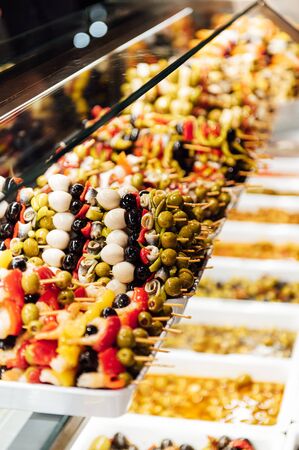 A wide variety of traditional tapas with seafood in Spain at the San Miguel marketの写真素材