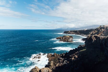 A powerful storm in the Atlantic Ocean in a bay on the coast of Tenerife. Northern Canary Island, Cape Charco De La Lajaの写真素材