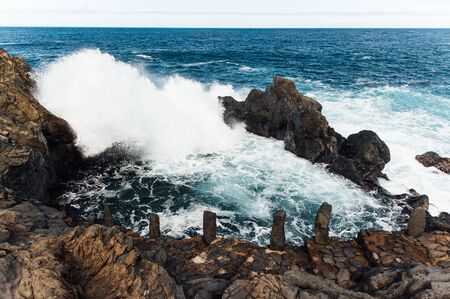 A powerful storm in the Atlantic Ocean in a bay on the coast of Tenerife. Northern Canary Island, Cape Charco De La Lajaの写真素材