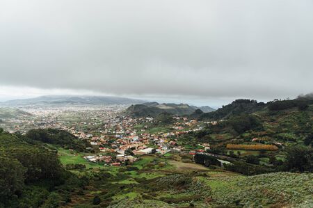 Small settlements between the mountain peaks on the Spanish island of Tenerifeの写真素材