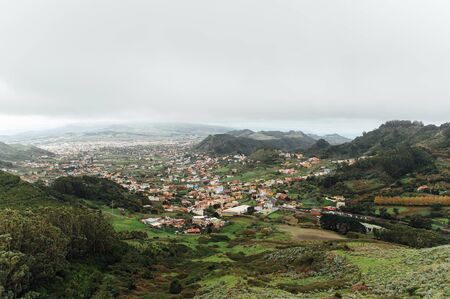 Small settlements between the mountain peaks on the Spanish island of Tenerifeの写真素材