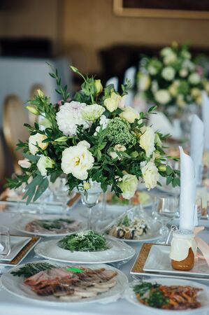 wedding decor, flowers, black and gold decor, candlesの写真素材