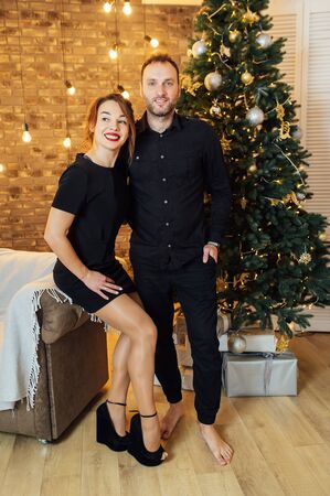 Romantic couple in love feeling happiness about their romance spending christmas eve together,の写真素材
