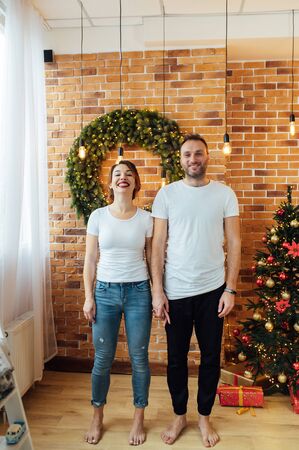 Romantic couple in love feeling happiness about their romance spending christmas eve together,の写真素材