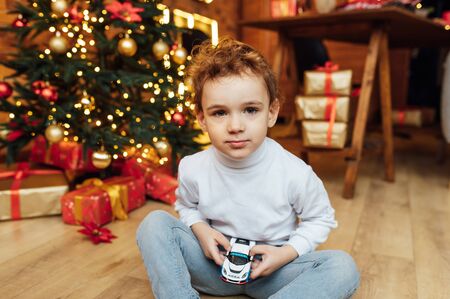 beautiful baby boy playing with toys and smilingの写真素材