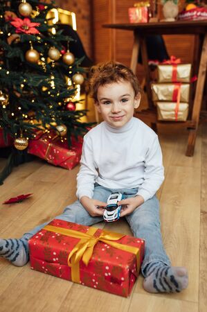 beautiful baby boy playing with toys and smilingの写真素材