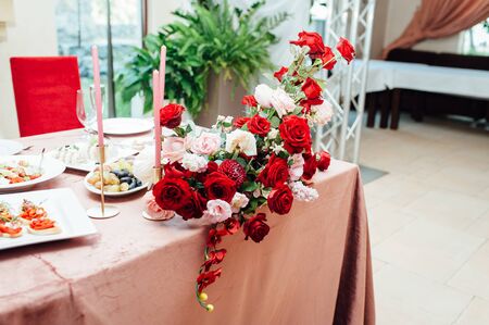 Luxurious wedding presidium in white with red elements.の写真素材